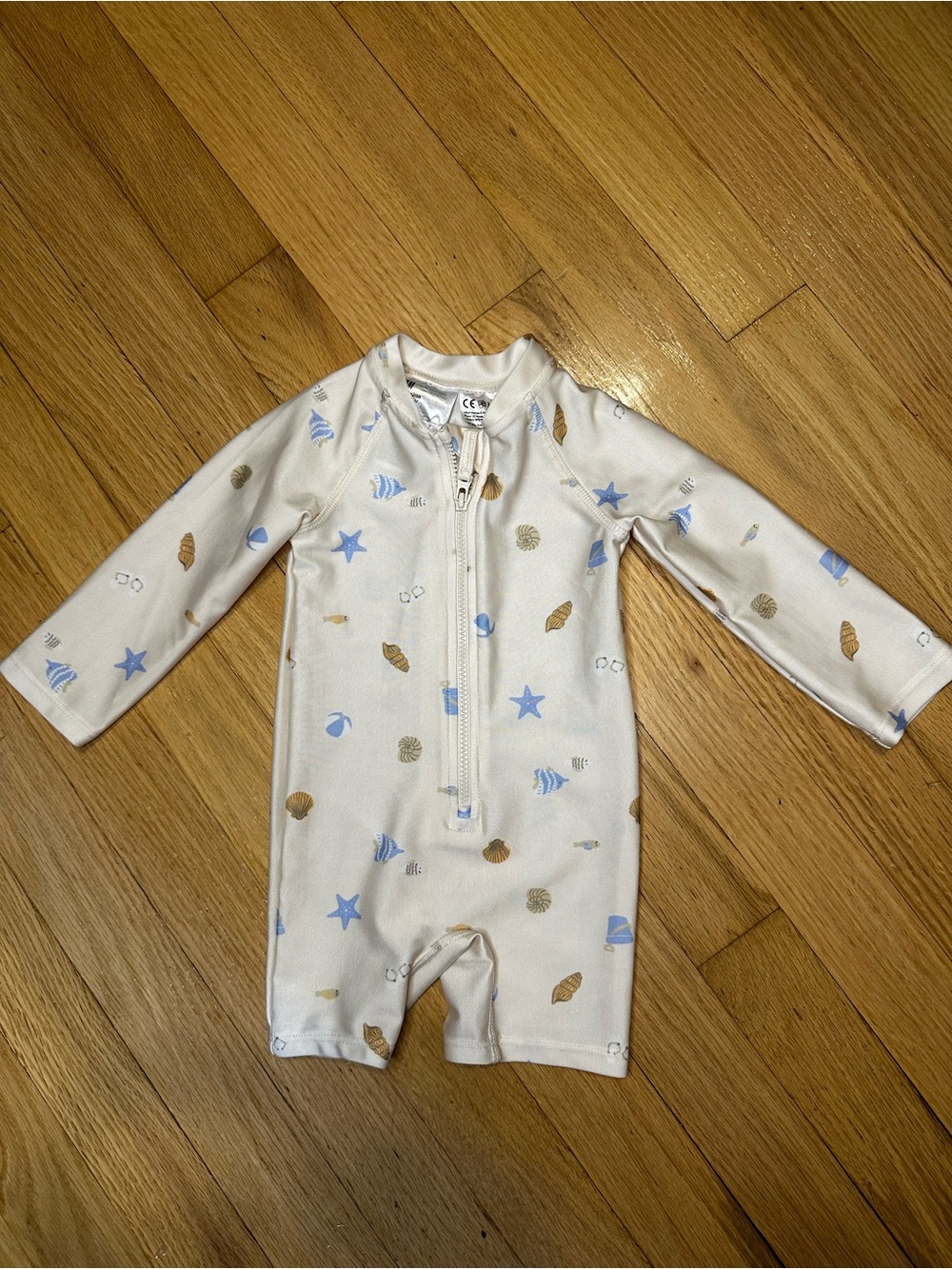 H&M 3-6M Long-Sleeve One-Piece Swimsuit in Cream with Blue & Tan Shell Print